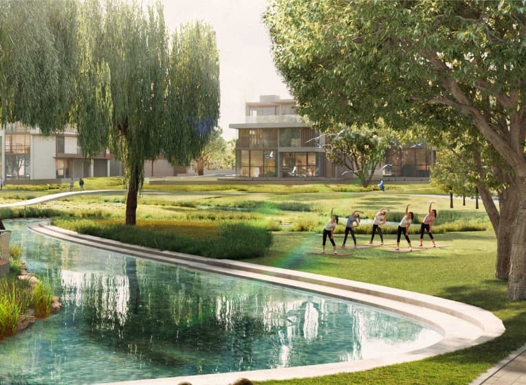 Yoga lawn surrounded by manicured gardens at Nad Al Sheba Gardens